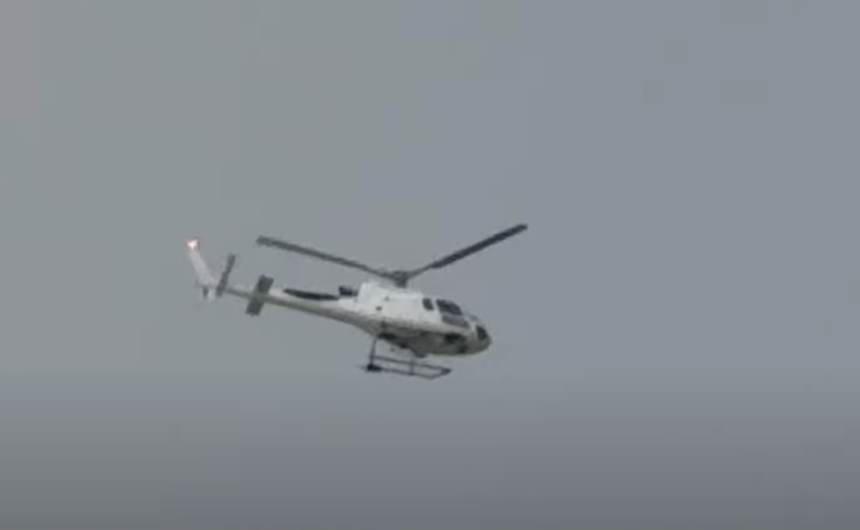 Commercial helicopter called in to help search for offenders circles above Dallington 