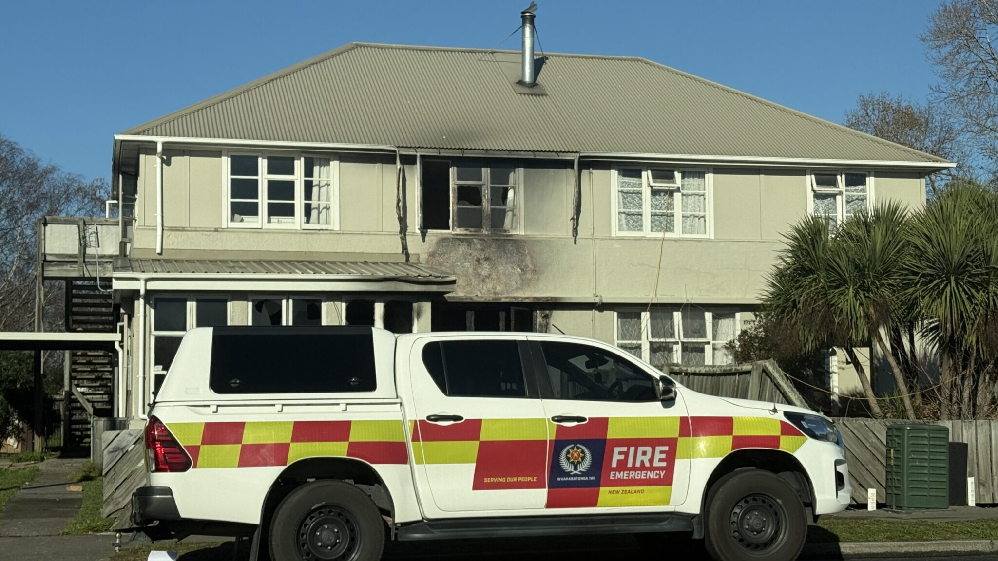 Man charged after mother throws daughter over flames to escape suspicious Riccarton house fire
