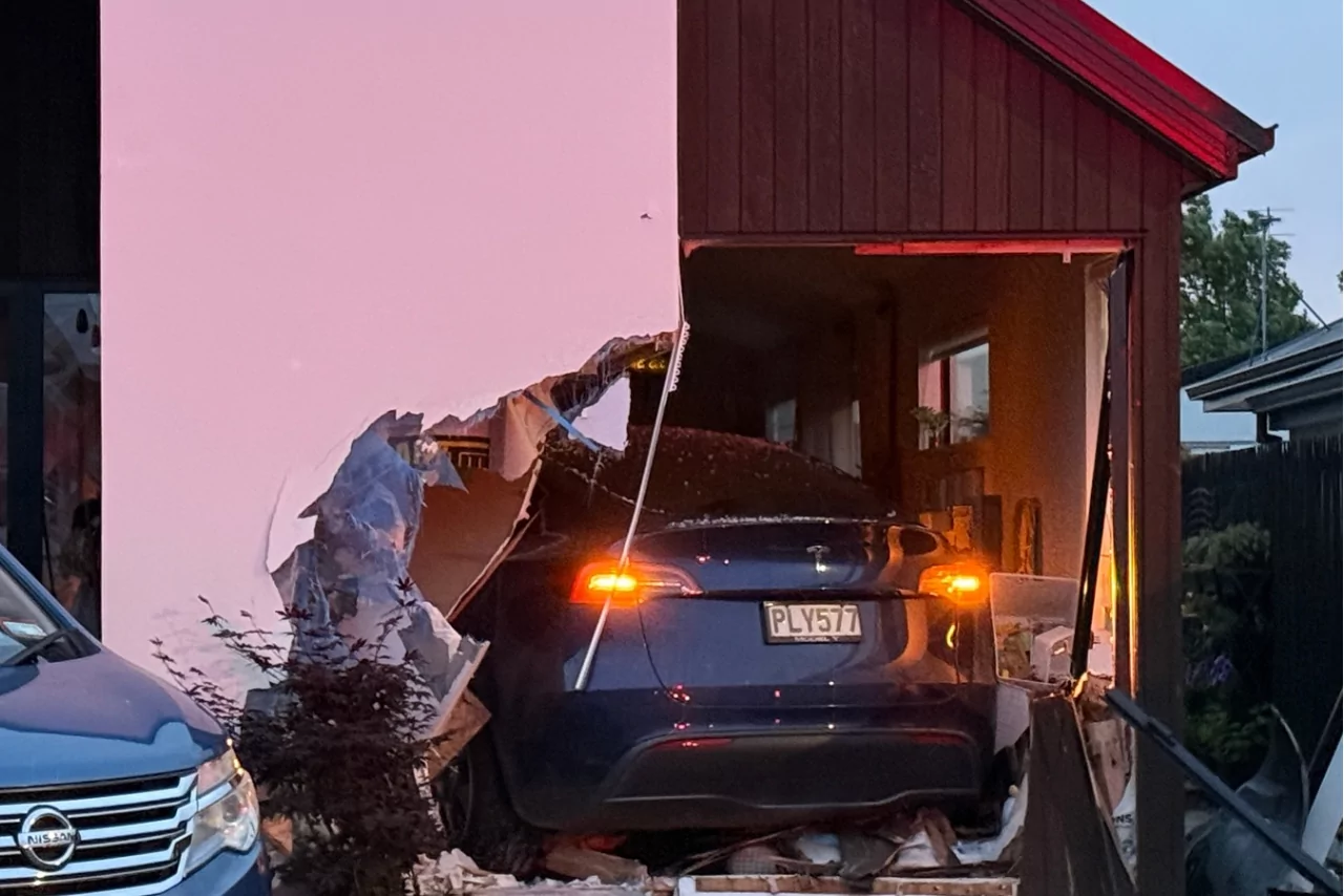 Driver rescued after car smashes into Wigram house