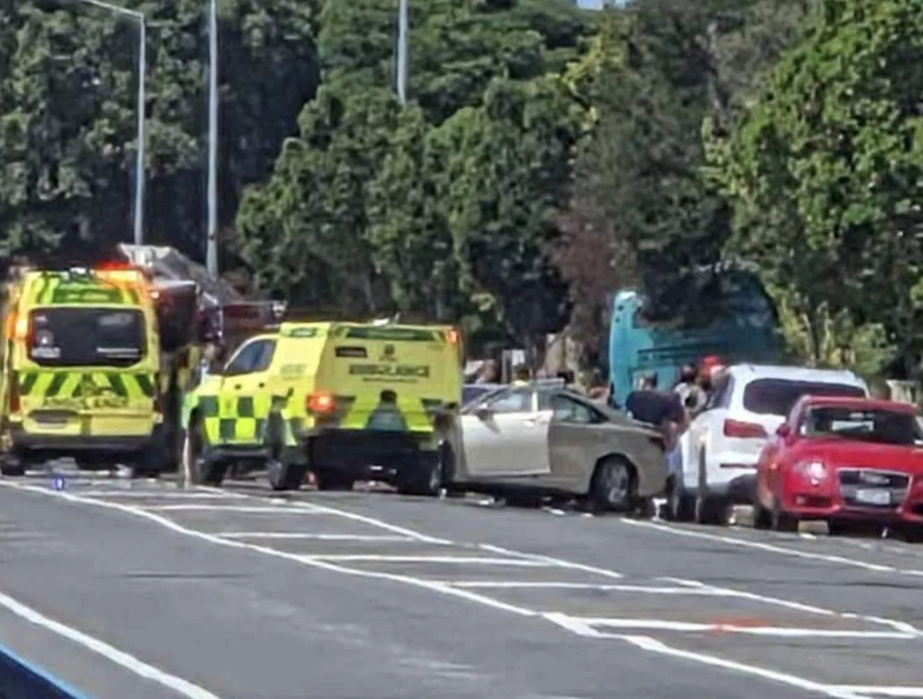 Emergency services at crash involving bus and vehicle