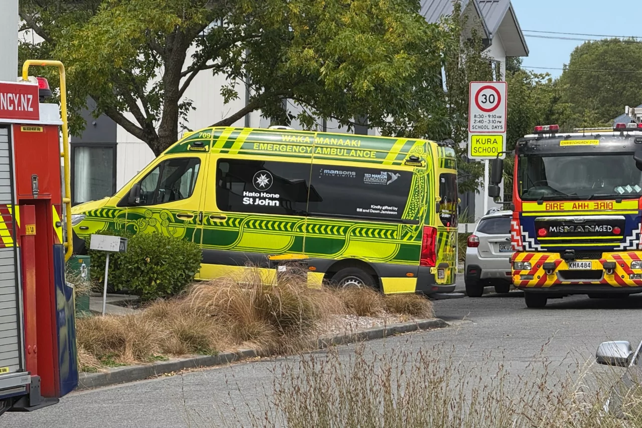 Man fighting for his life after being pulled from burning property