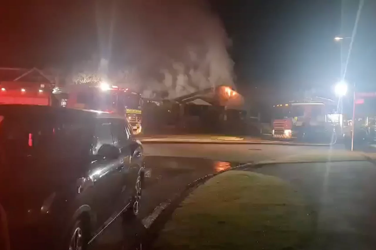 Emergency services at fatal house fire; multiple people injuired